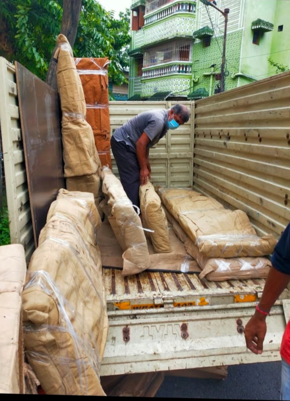 Crew loading labelled cartons into a Nexaro truck